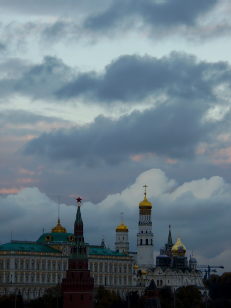 Heavy clouds over gold-capped towers of the Kremlin complex