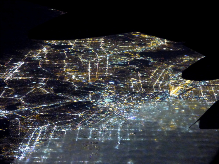The evening city lights of the streets of Los Angeles as seen from a plane