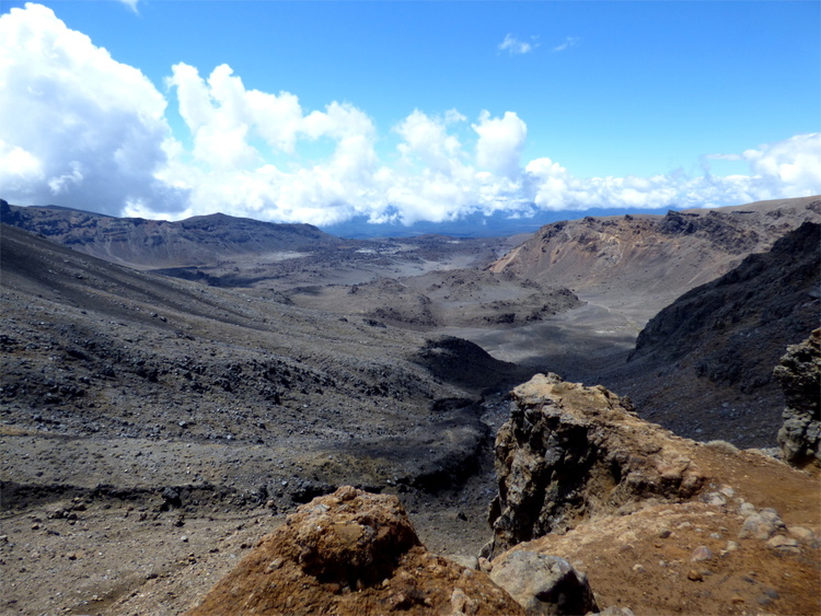 View of a barren, rust-coloured rocky landscape