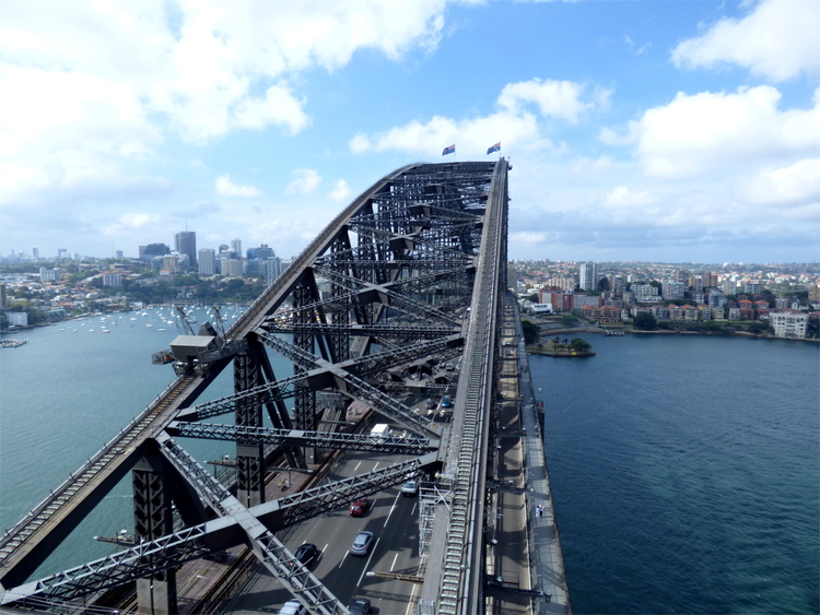 A view from the top of the Sydney harbour bridge showing its criss-crossing steel beams