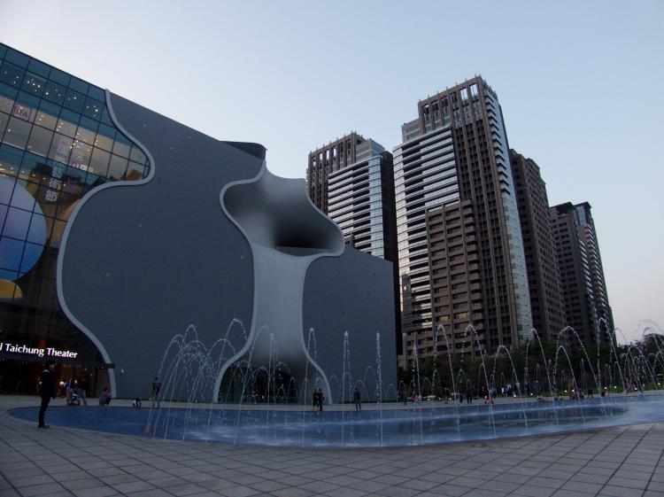 Water fountains outside the modern facade of the Taichung theater house