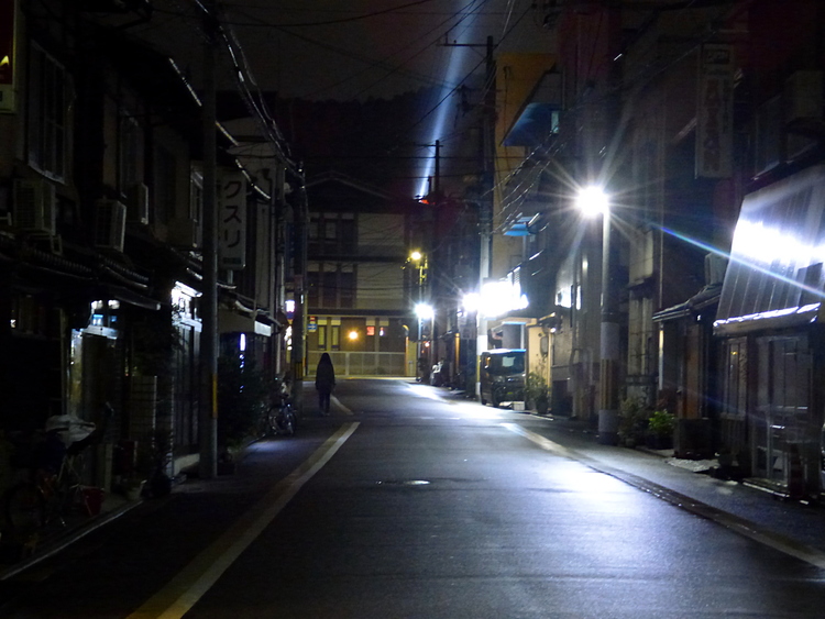 An empty residential alley at night